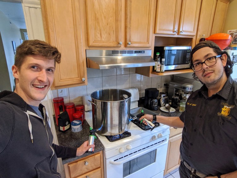 Dariusz and Nick heating a brew kettle with brulee torches